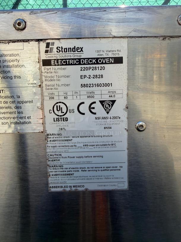 Bakers Pride EP-2-2828 Double Deck Pizza Oven label shows model number, serial number, voltage, and safety warnings.
