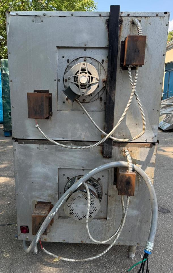 Back view of the VULCAN ET88 double stack convection oven showing electrical and ventilation components, used condition.