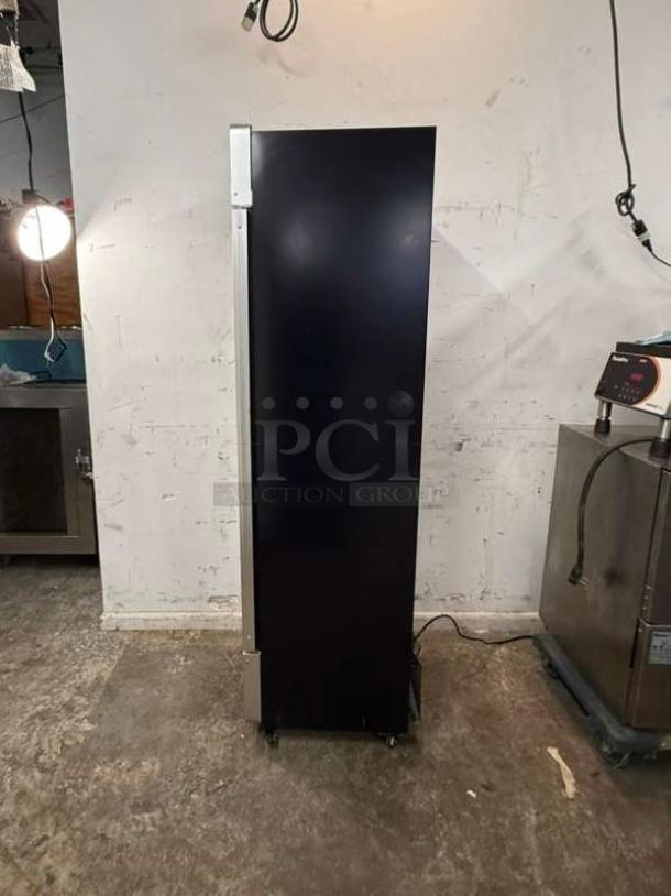 Yukon USF-175BLK commercial single glass door freezer, black, upright model. Appears in good condition.