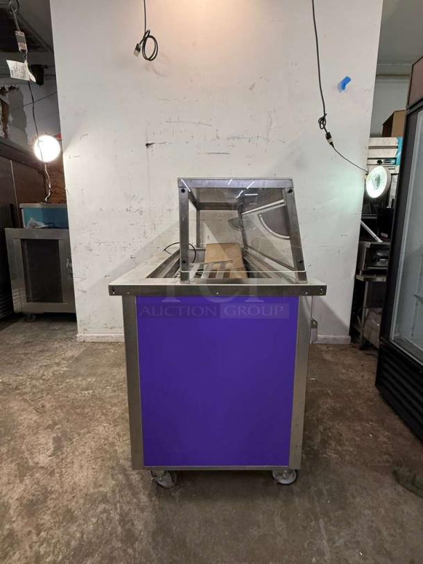 Delfield SCSC-60-EFP 60" refrigerated food serving counter, stainless steel, with drain, on wheels, good condition.