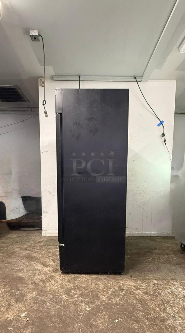 TRUE GDM-49-HC~TSL01 glass door merchandiser, black, two left-hinge doors, 115v. Shows visible wear.