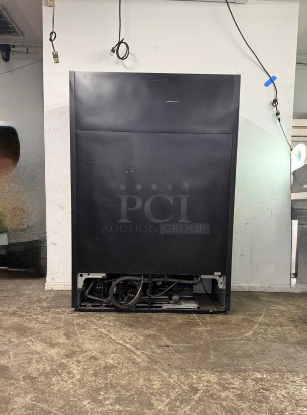 TRUE GDM-49-HC~TSL01 two-section glass door merchandiser, black, 115v, visible compressor area, condition shown, no visible tags.