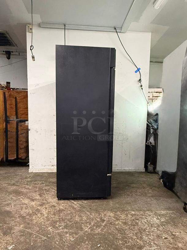 TRUE GDM-49-HC~TSL01 glass door merchandiser, black, two left hinge doors, 115v, new condition, side view.