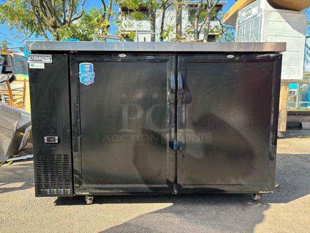 DUKERS DBB60 kegerator, black, tested and working. Dual doors, temperature display, warranty stickers visible.