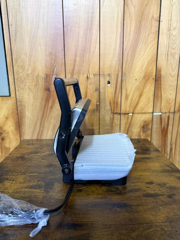 Elite Gourmet nonstick panini press and indoor grill, new condition with protective foam, featuring a floating hinge.