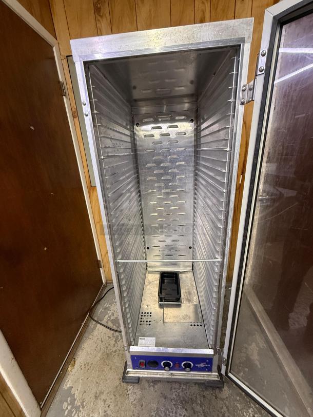 Full-size insulated proofer/warming cabinet with stainless steel interior, clear door, temperature controls, and visible wiring.