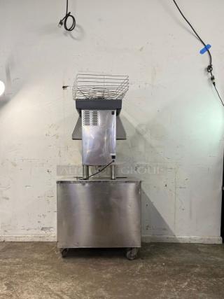 ZUMMO Z40-N-LM citrus juicer, stainless steel, automatic feed, 25 fruits/min, 290W, 120v, on wheels, used condition.