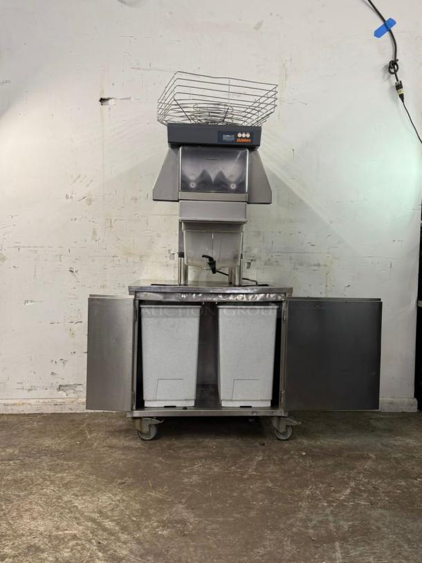 Zummo Z40-N-LM citrus juicer, automatic feed, cold press, processes 25 fruits/min, 290W, 120v, stainless steel, on wheels.