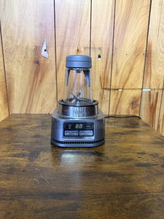 NINJA SS101 blender in excellent condition, 1200 peak watt motor, digital display, labeled settings for smoothies and sauces.