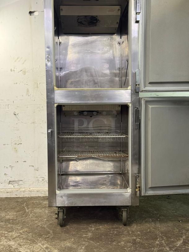 VICTORY Dual Temp RFS 1D S7 HD refrigerator/freezer. Stainless steel, dual compartments, visible shelves, good condition. Wheels for mobility.