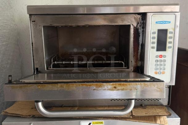 Turbo Chef NGC Toronado high-speed convection oven with keypad, ventless design. Visible wear on stainless steel exterior.