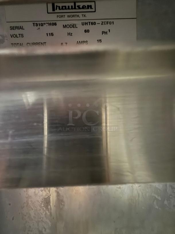 TRAULSEN UHT60-LR undercounter refrigerator, 60"W, 2 sections, 2 doors, 115v. Label shows model and electrical details.