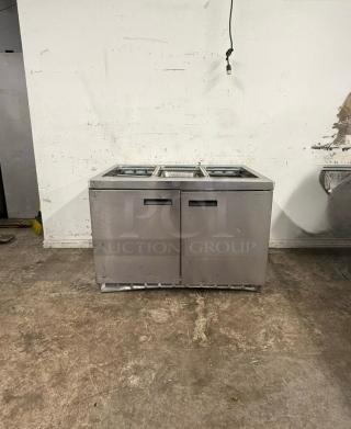 Delfield 4448NP-18M 48" refrigerated sandwich prep table, two doors, stainless steel, good condition.