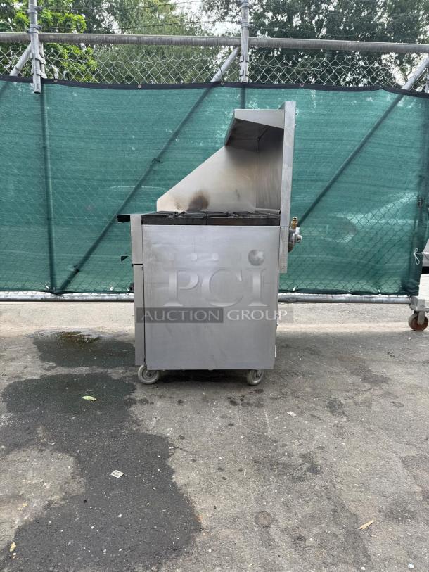 Vulcan 36S-6BN gas range, 36", 6 burners, standard oven, 215,000 BTU, stainless steel, good condition, outdoor setting.