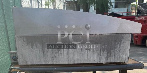 Toastmaster 36" countertop flat grill, thermostatic control, gas griddle. Visible wear on surface, stainless steel body.