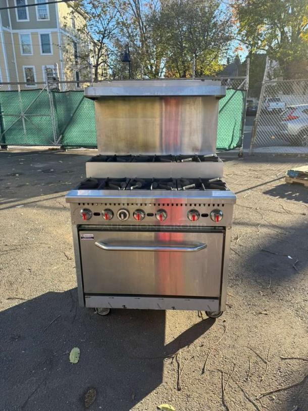 Pro Series 36" gas range, 6 burners, step-up design, with standard oven and overshelf. Stainless steel, good condition.
