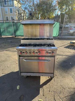 Pro Series 36" gas range, 6 burners, step-up design, with standard oven and overshelf. Stainless steel, good condition.
