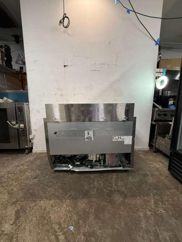 Brand new Atosa MSF8302GR 48" refrigerated sandwich prep table with 2 hinged doors, some visible scratches and dents.