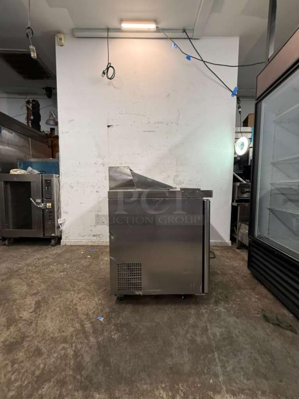 Brand new ATOSA MSF8302GR 48" refrigerated sandwich prep table, two hinged doors, holds twelve 1/6 pans, slight scratches.