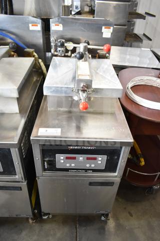 2022 Henny Penny 600 Pressure Fryer, natural gas, 80,000 BTU, on casters, good condition, Computron 1000 controls.