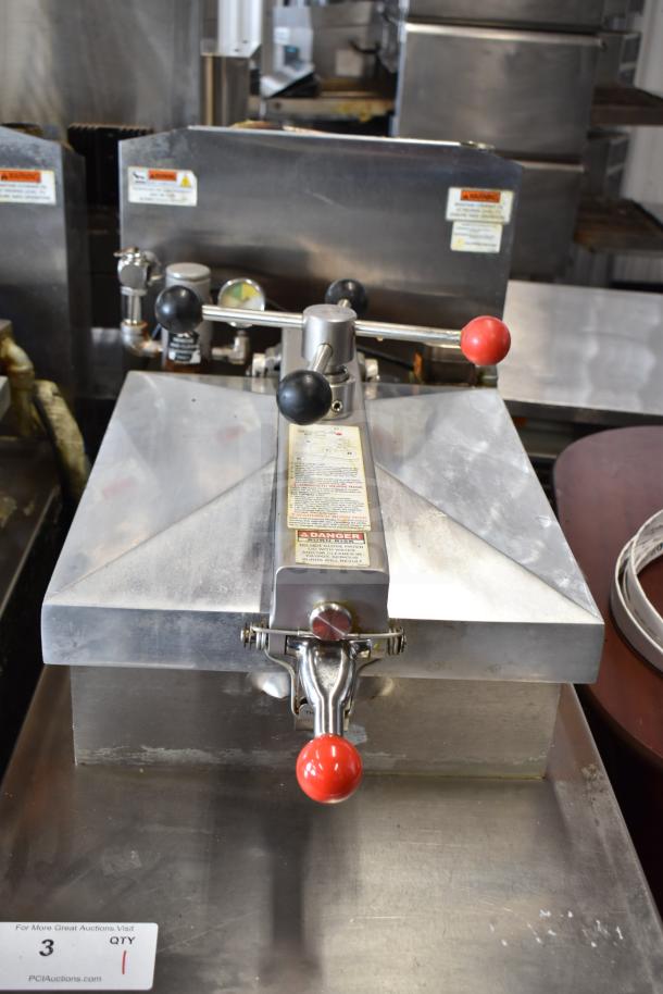 2022 Henny Penny 600 pressure fryer, natural gas, 80,000 BTU, stainless steel, on casters, warning labels visible.