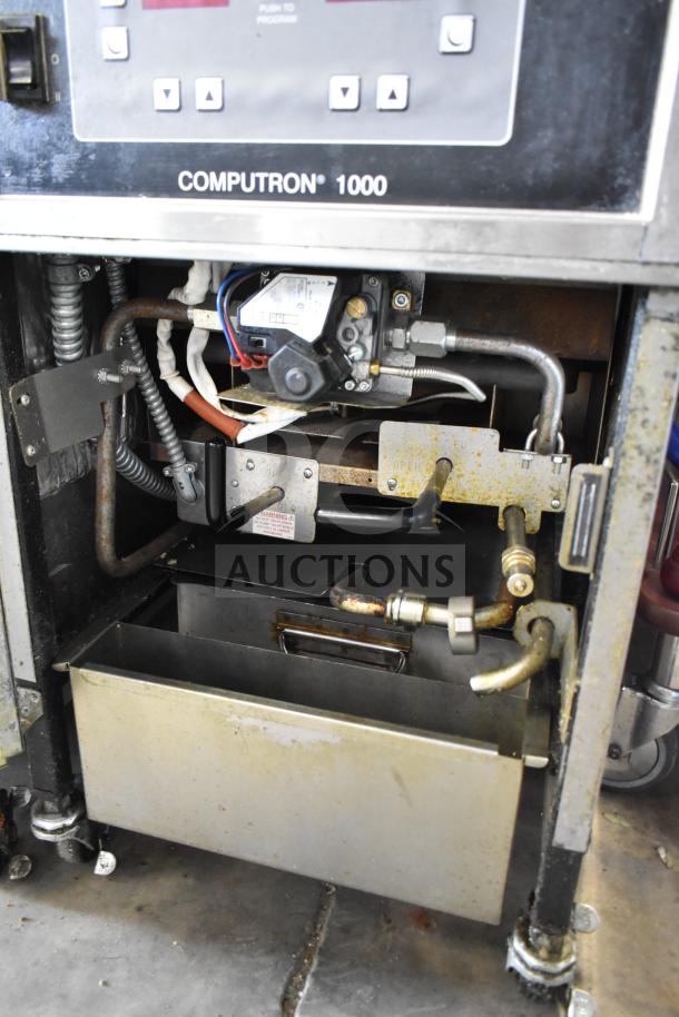 2022 Henny Penny 600 pressure fryer, natural gas, 80,000 BTU, on commercial casters, features Computron 1000 controls.