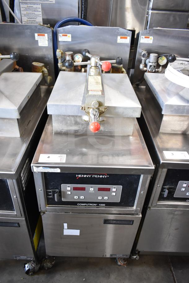 2021 Henny Penny 600 commercial gas pressure fryer, 80,000 BTU, on casters, digital controls, stainless steel, good condition.