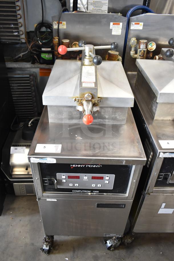 2021 Henny Penny 600 pressure fryer, stainless steel, 80,000 BTU, on casters. Control panel displays brand and model.