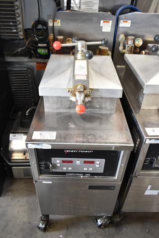 2021 Henny Penny 600 pressure fryer, stainless steel, 80,000 BTU, on casters. Control panel displays brand and model.