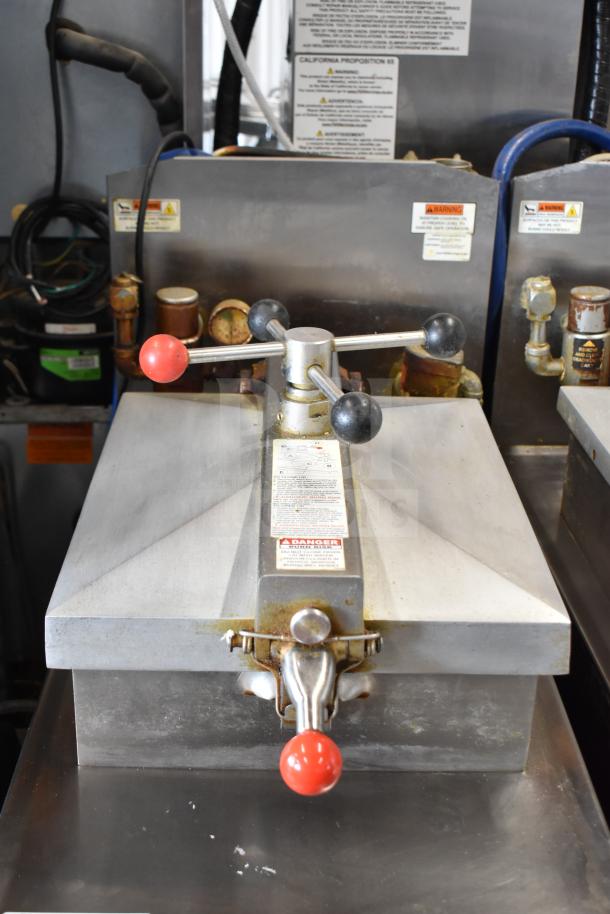 2021 Henny Penny 600 natural gas-powered pressure fryer, 80,000 BTU, on commercial casters. Visible warning labels.