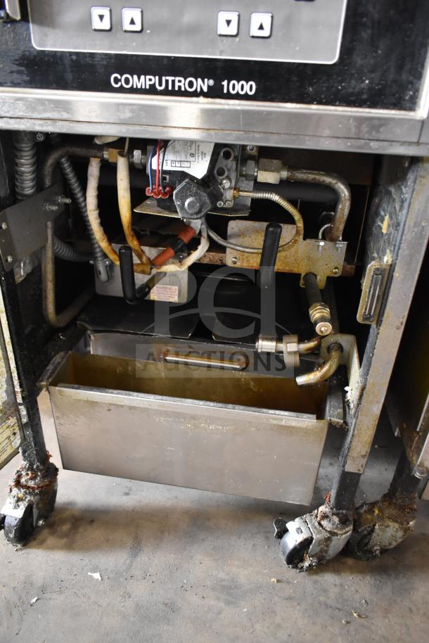 2021 Henny Penny 600 Gas Pressure Fryer, floor style, 80,000 BTU, on commercial casters, visible Computron 1000 control panel.