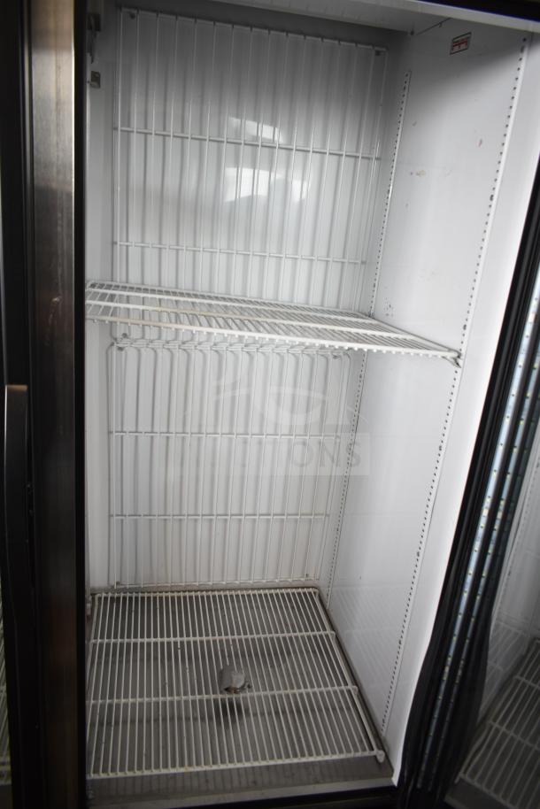 2020 True GDM-49F-HC Commercial 2 Door Freezer with wire shelving, clean interior, 115/208-230V, 1 Phase.