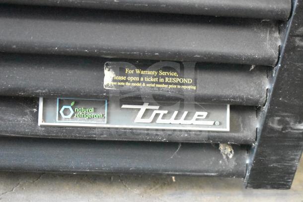 2020 True GDM-49F-HC commercial freezer label showing brand, natural refrigerant symbol, and warranty service instructions.