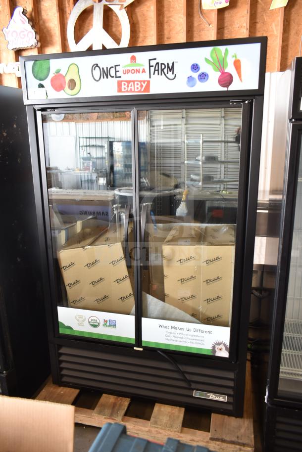 2025 True TVM-48SL-HC commercial 2-door reach-in cooler merchandiser. Brand new, scratch and dent. 115 volts, 1 phase.