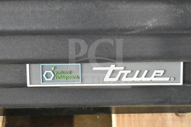 True TVM-48SL-HC cooler close-up, natural refrigerant label, new condition, 115V, single phase, 2025 model.