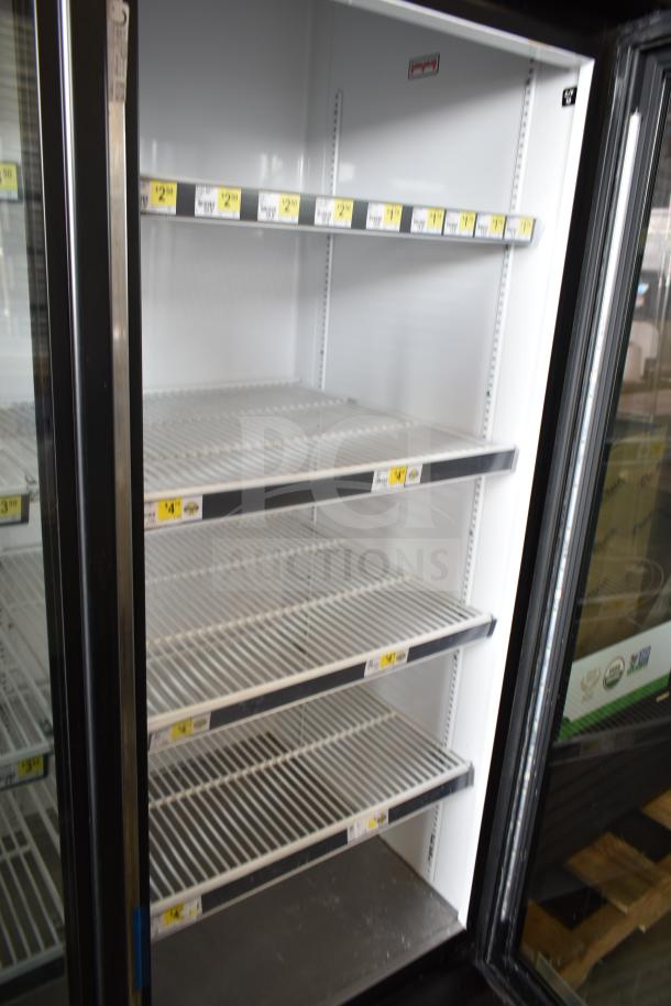 2018 True GDM-72-HC commercial 3-door cooler, used, with adjustable white wire shelves; 115 volts, 1 phase.