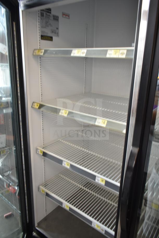 2018 True GDM-72-HC commercial 3-door cooler merchandiser, 115 volts, 1 phase, spacious shelving, good condition.