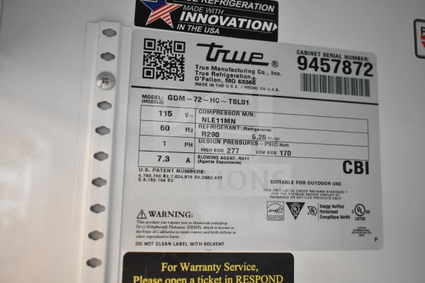 2018 True GDM-72-HC commercial cooler tag, 115V, 1 phase, R290 refrigerant, model details, and safety warnings visible.