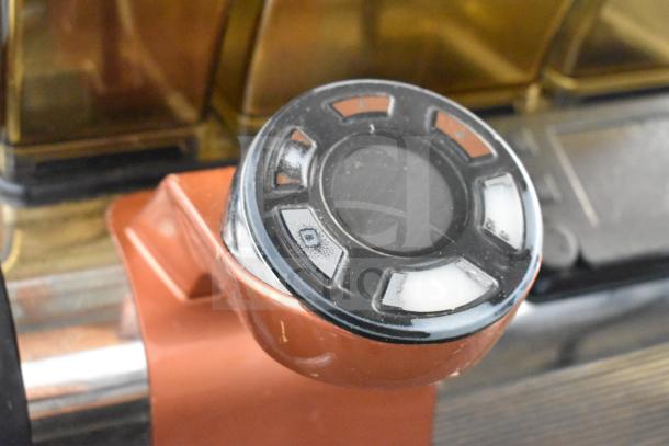 Close-up of 2019 Thermoplan Mastrena M2-CS espresso machine's knob. Stainless steel, commercial countertop model.