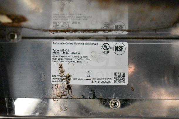 2019 Thermoplan Mastrena M2-CS espresso machine label. Features 208V, 60Hz, 5800W. NSF and UL listed. Made in Switzerland.