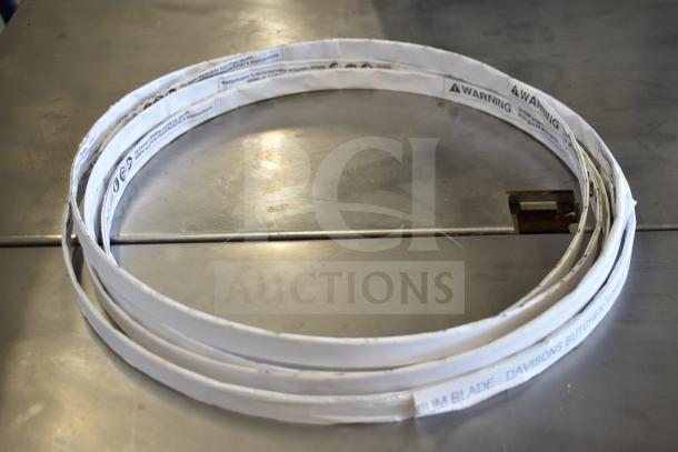 Commercial meat saw on floor stand with casters. Blade labeled “Davison’s Butcher Supply.” Sturdy build, clean condition.