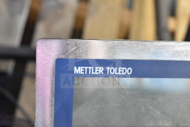 Mettler Toledo ICS4x9-1 commercial bench scale, brushed metal finish, 100-240V, 1 phase, logo visible on display frame.