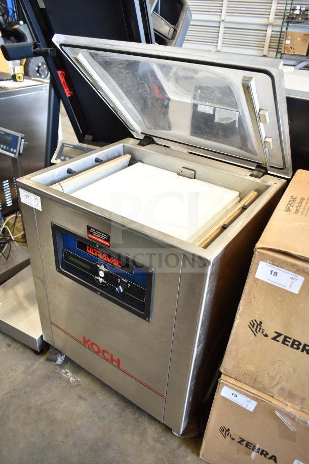 Koch Ultravac UV500 vacuum sealer, commercial floor model, on casters, stainless steel, 240V, 3-phase, lid open.