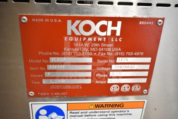 Koch Ultravac UV500 Vacuum Sealing Machine, 240V, 3 Phase, commercial casters; metal plate shows model, serial, and voltage details.