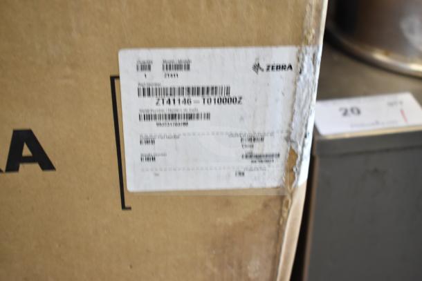 Box of Zebra ZT41146-T010000Z Barcode Scanner, brand new with scratch and dent. Visible label details model and origin.