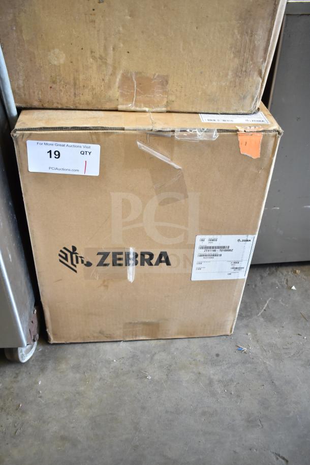 Brand new Zebra ZT41146-T010000Z barcode scanner in original box. Scratch and dent condition label visible.