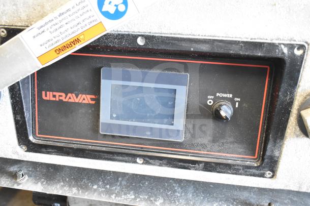 2016 UltraSource Ultravac UY 2100 vacuum sealing machine control panel. Features touchscreen, power knob, warning label.
