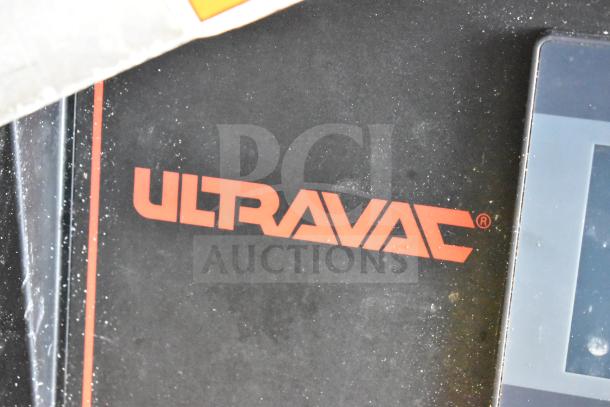 2016 UltraSource Ultravac UY 2100 vacuum sealer, floor style with commercial casters, 230V, 3-phase. Visible Ultravac logo.