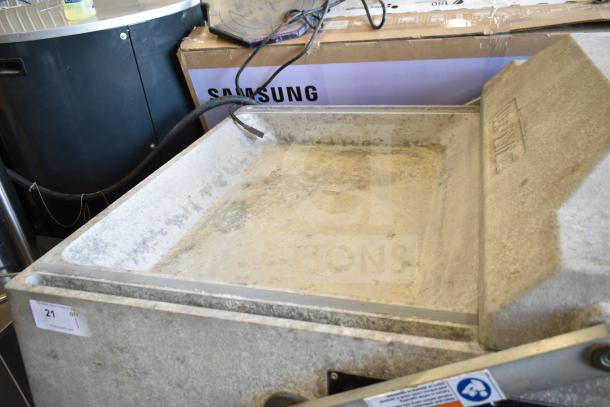 2016 UltraSource Ultravac UY 2100 vacuum sealing machine on casters, 230V, 3 Phase; used, with visible wear.