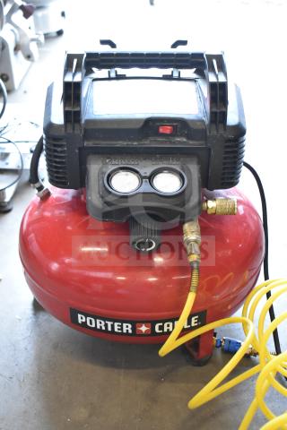 Porter & Cable C2002 Air Compressor, 120V, 1 Phase, visible pressure gauges, and yellow hose. Clean condition.